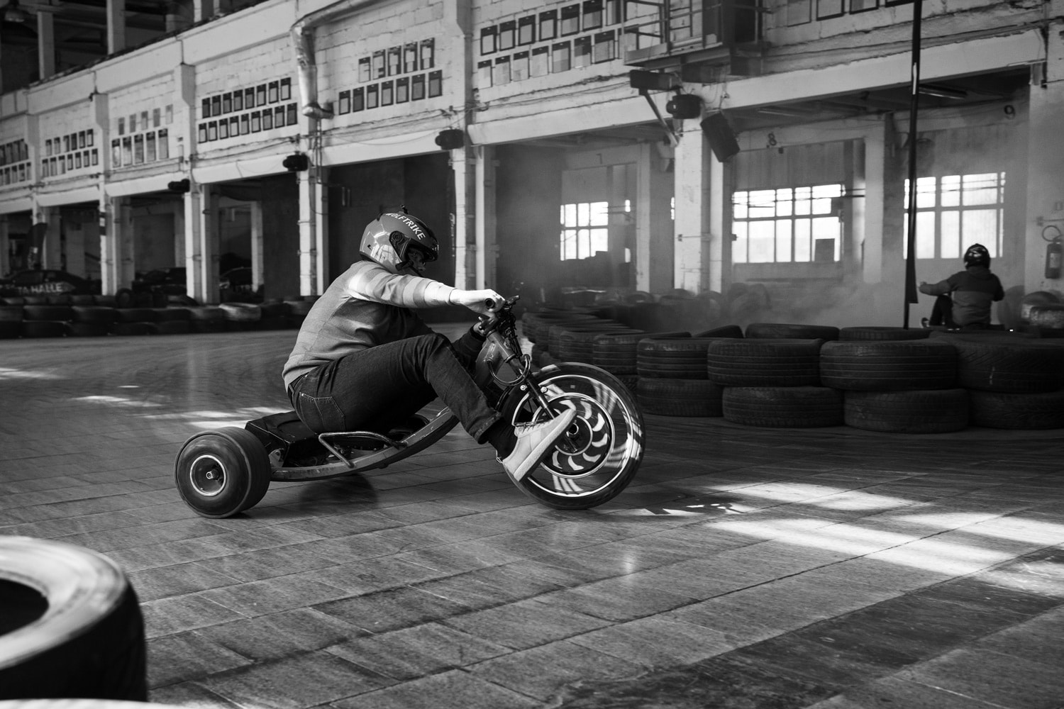 Photo of a man riding drift bike. Shallow depth of field in sports photography.